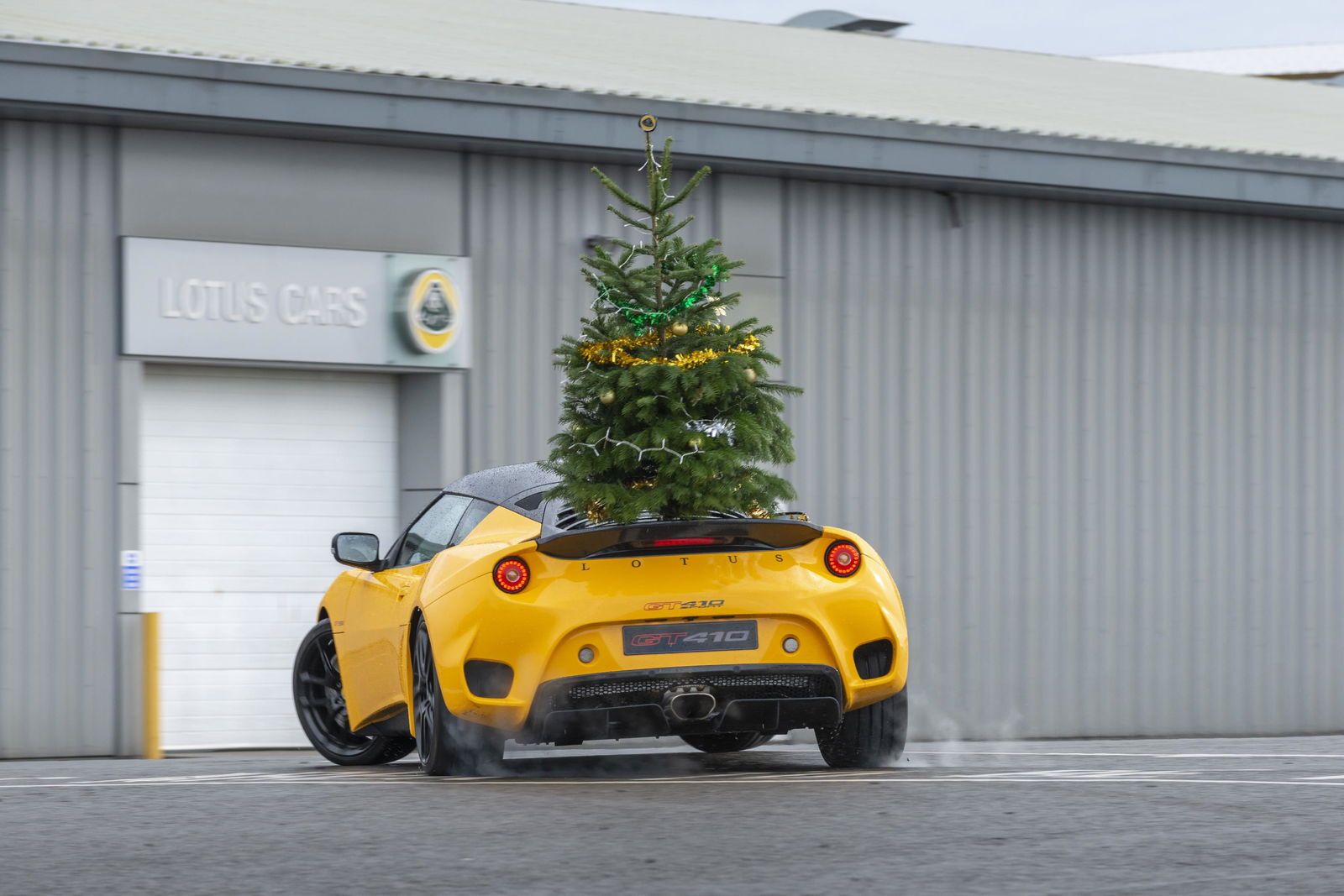 Lotus Wishes You A 'Merry Driftmas' With A Tree-Carrying Evora