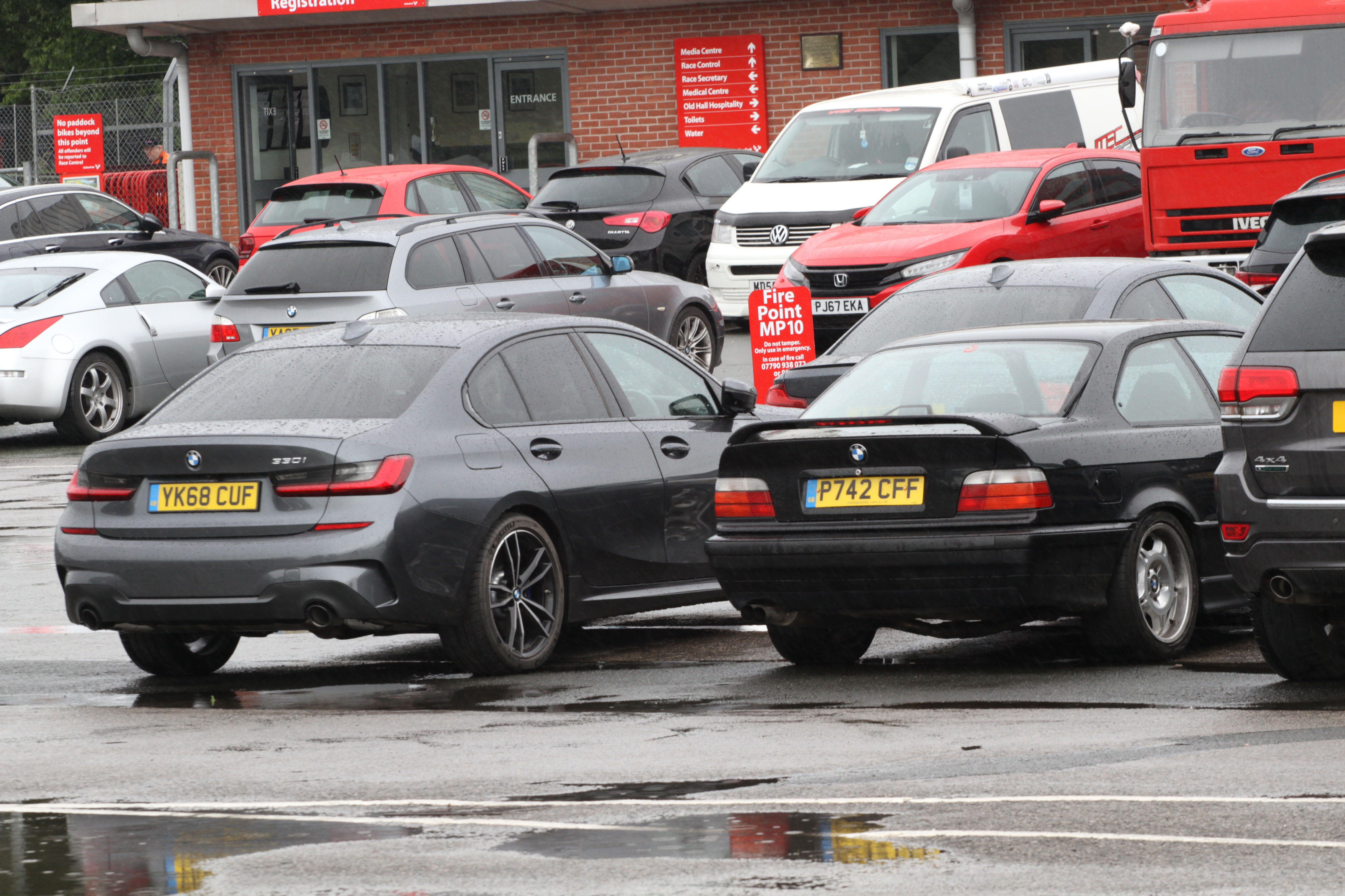 The new 330i saloon alongside the comparatively tiny E36 M3 of the '90s