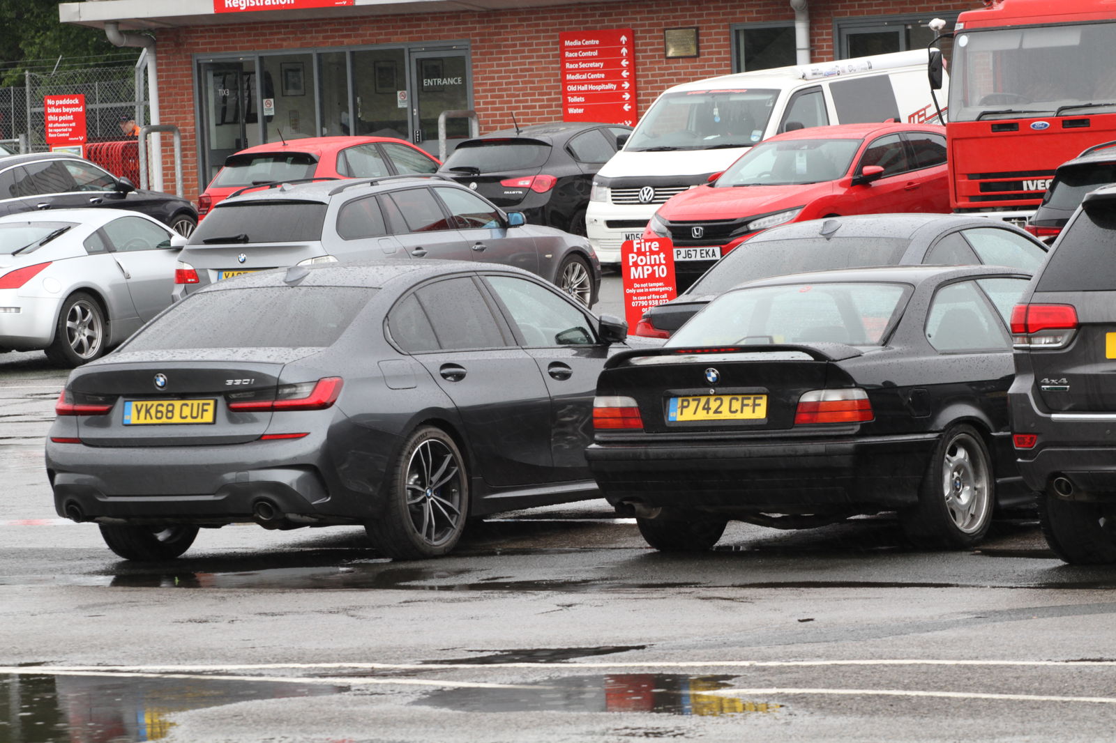 The new 330i saloon alongside the comparatively tiny E36 M3 of the '90s
