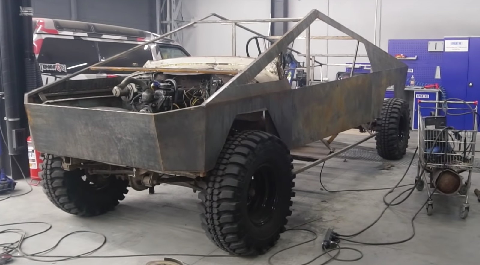 The replica Tesla CyberTruck has been fitted with a longer propshaft (Image via YouTube/Garage54)