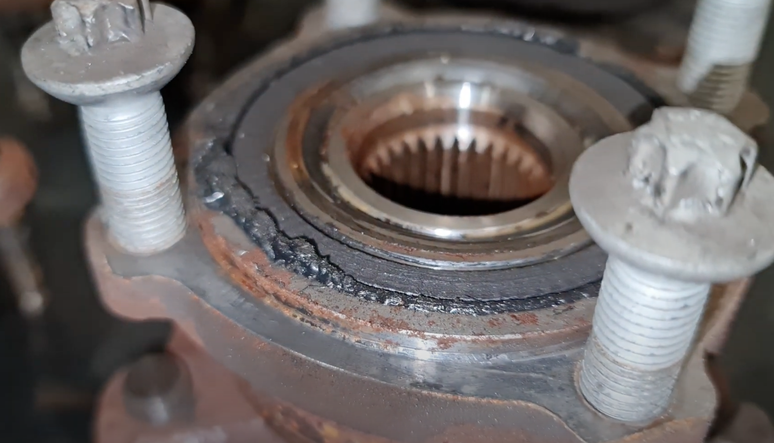 Escaping grease shows that this M4 wheel bearing is rather past its best...