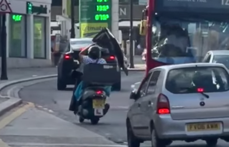An Open Tesla Model X Falcon Wing Door Is No Match For A London Bus
