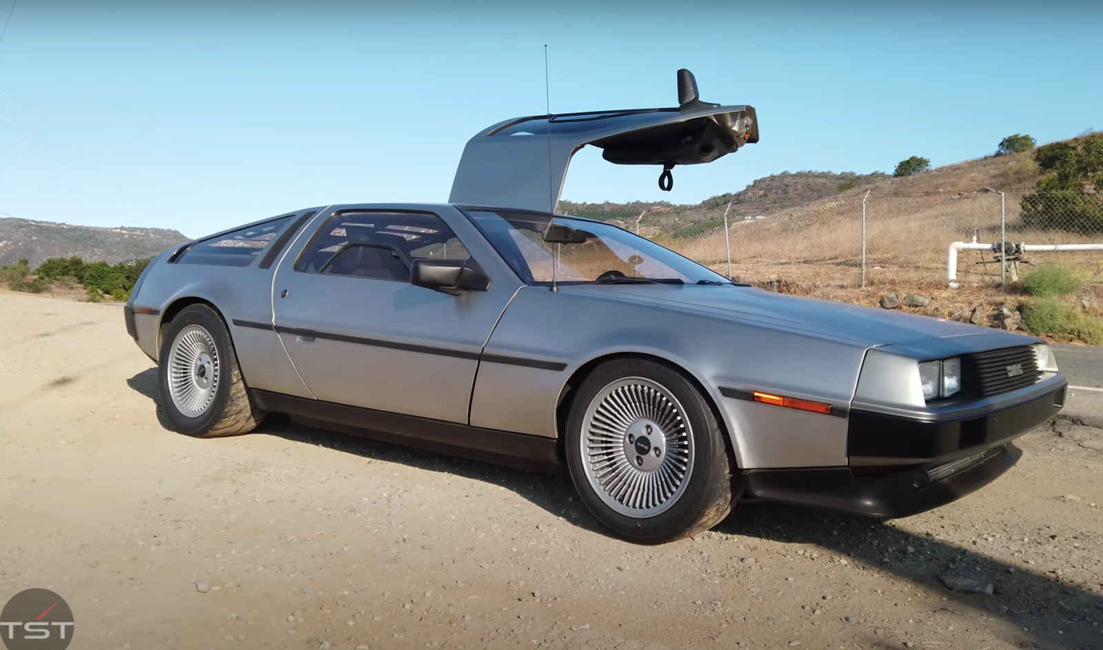 It looks like a regular DeLorean from the outside, but it most certainly isn't (Image via YouTube/TheSmokinTyre)