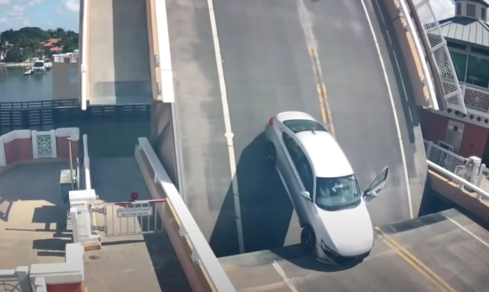 Watch As A Drawbridge Is Accidentally Raised With A Car Still On It